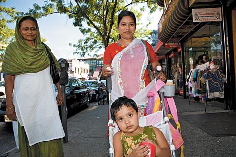 Photograph: Sophia Wallace, Time Out New York. This photograph depicts a typical South Asian scene in Jackson Heights. A grandmother, mother, and daughter (the old and new generation) are seen in traditional Sari attire, shopping on the streets.