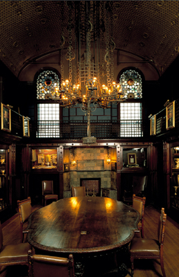 The Library is known as the Silver or Trophy Room.  It was designed by Louis Comfort Tiffany. 